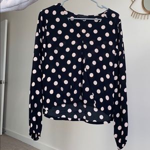 Polka-dot blouse.